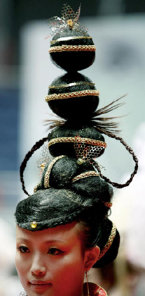A model shows off her hairstyle during a hairdressing contest in Hangzhou, east China's Zhejiang province October 11, 2006.