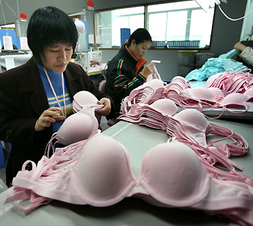 Chinese workers produce bras at a textile factory in Dongguan, southern China's Guangdong province February 19, 2006. 