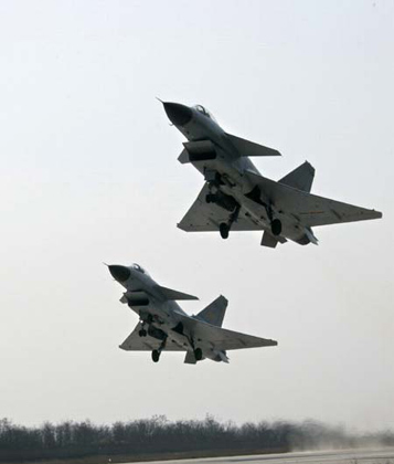 Two Jian-10 fighters of China air force take off from a military base December 18, 2006. The air force has been equipped with the new generation of fighters, independently designed by China. The fighter has the 