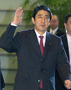Japanese Prime Minister Shinzo Abe enters his official residence in Tokyo December 28, 2006. 