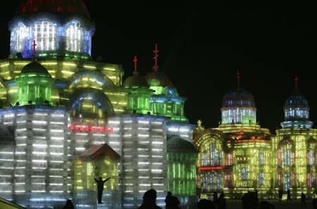 People visit at an ice sculpture art exhibition for the upcoming the China Harbin international ice and snow festival in Harbin, northeastern China's Heilongjiang Province, January 4, 2007.