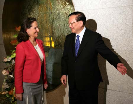 China's State Councilor Tang Jiaxuan (R) greets French presidential candidate Segolene Royal at the Diaoyutai State Guesthouse in Beijing January 7, 2007. China hopes that the Socialist Party of France will continue to play a positive role in pushing forward the Sino-French strategic partnership,China Daily reported. [newsphoto]