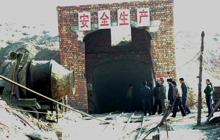 A general view of two shafts where thirty-six miners are trapped in a flooded iron ore mine near Baotou, northern China's Inner Mongolia Autonomous Region, January 17, 2007. The thirty-six Chinese miners were trapped in flooded iron ore pit shafts on Wednesday and it was unknown if they were dead or alive, Xinhua News Agency said