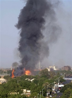 Smoke and flames are seen in Khartoum near the military headquarters in Khartoum, the capital of Sudan after a military truck carrying ammunition exploded as a result of a fire on the vehicle Saturday, April 7, 2007. The blast caused no casualties, the army said. [AP]