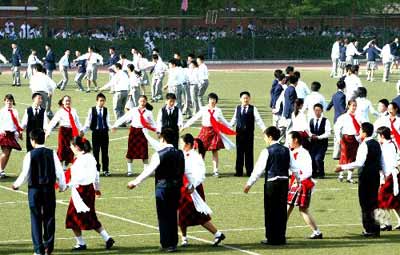 Students dance during a break in a high school in Beijing.