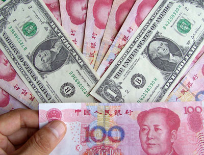 Chinese currency and US dollar banknotes are seen in this photo taken on 
