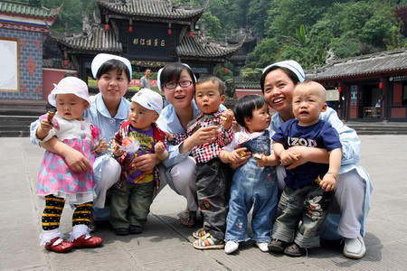 Quake babies reunite with nurse rescuers one year on