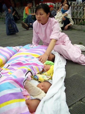 Quake babies reunite with nurse rescuers one year on