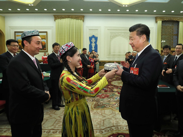 Xi calls for building 'great wall of iron' for Xinjiang's stability