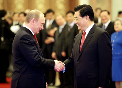 Putin, Hu Jintao meet in Beijing