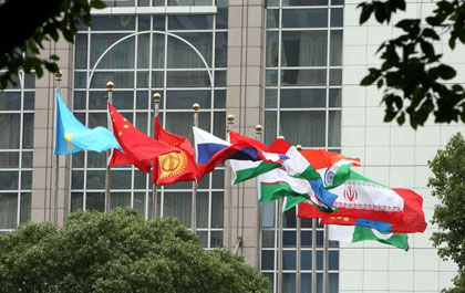 Flags of the countries participating in the Shanghai Cooperation Organization (SCO) Summit are displayed at the convention yard in Shanghai, June 13, 2006.