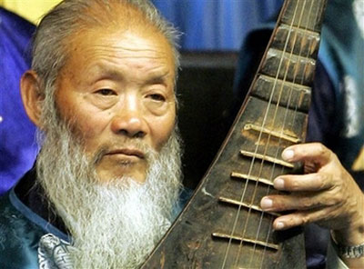 Naxi Orchestra members play songs in Lijiang