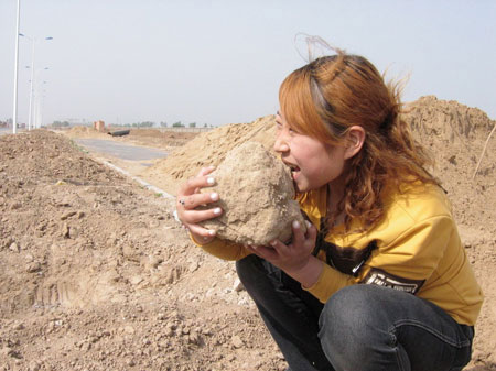 Girl fascinated with eating earth