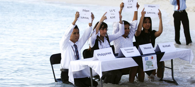 Environmental activists demonstrate in Cancun