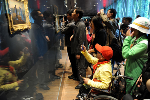 Disabled quake children visit Expo Site