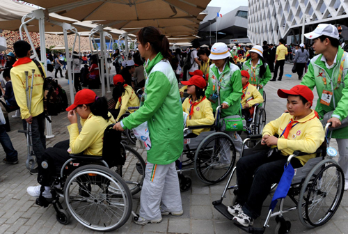 Disabled quake children visit Expo Site