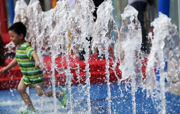 Visitors cool off at Expo Garden