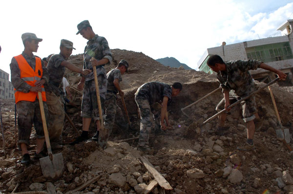 Frantic search for signs of life after landslide