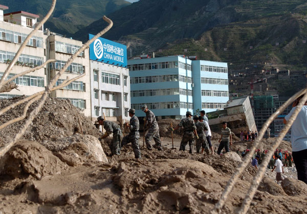Frantic search for signs of life after landslide