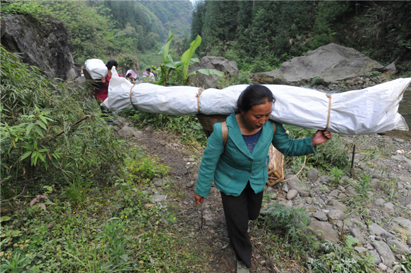 Villagers climb mountains to get relief supplies