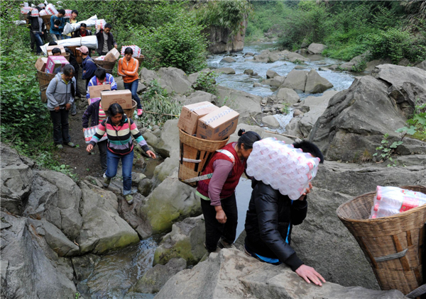 Villagers climb mountains to get relief supplies