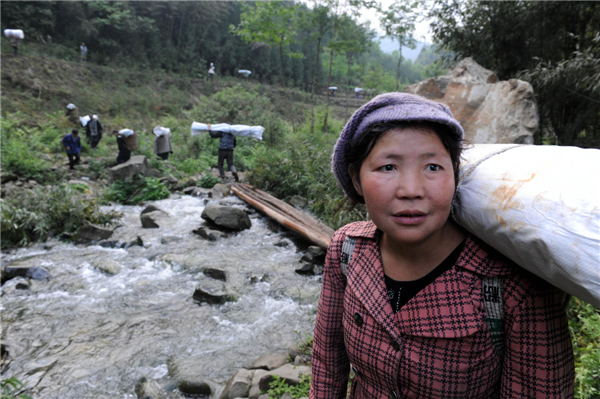 Villagers climb mountains to get relief supplies