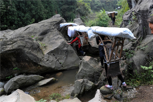 Villagers climb mountains to get relief supplies