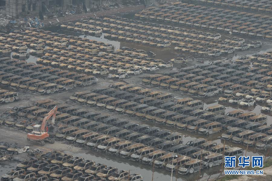 Burnt vehicles cleaned up in core blast area in Tianjin