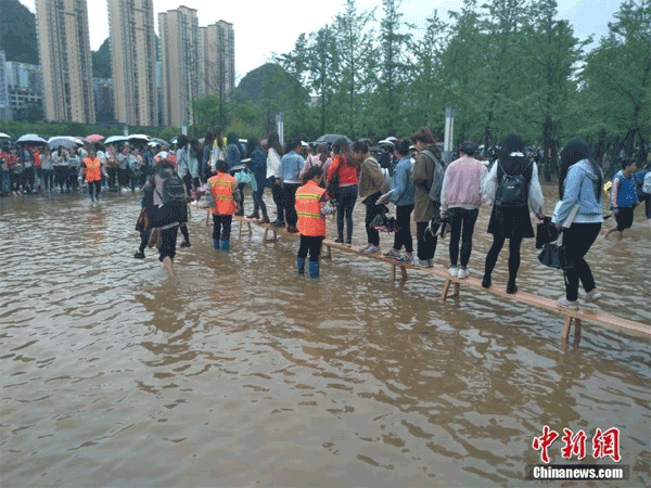 College students afraid to cross pool of water seek help of female cleaners