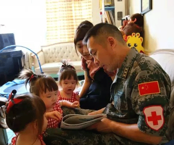 Daughters cry as dad heads abroad for peacekeeping