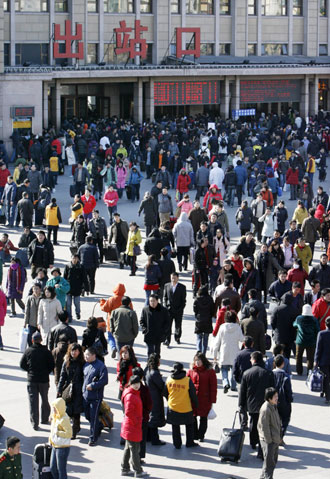 Chinese travellers crowd Beijing Railway Station February 12, 2008. China is expected to see railway traffic peak on Tuesday, the last day of Spring Festival, as the Lunar New Year holiday is known, when millions head back to work from their hometowns. 'Post-Spring Festival railway traffic peak saw more than 5 million passengers in one day last year and we expect more in 2008,' Xinhua news agency quoted the Railways Ministry as saying. [Agencies]