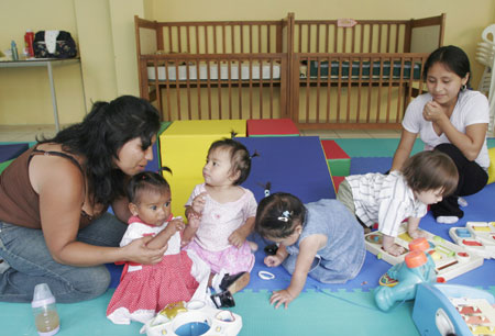Inmates take care of babies in the day care center inside Lima's Santa Monica women's prison, March 7, 2008. Saturday marks the United Nations International Women's Day around the world. [Agencies]