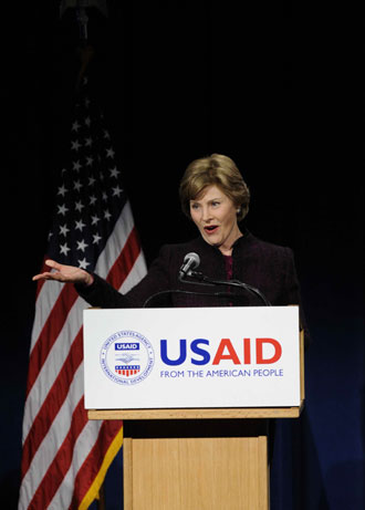 US First lady Laura Bush delivers a speech during the observance of the International Women's Day celebration, which fall on Saturday, at the Ronald Reagan Building in Washington, D.C., March 7, 2008. [Xinhua]