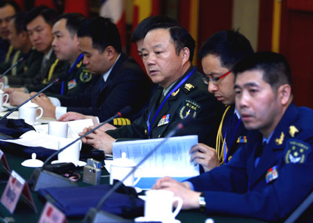 Senior military experts from China and ASEAN member countries discuss a point at the 'Military Modernization and Mutual Trust Building' dialogue in Beijing March 12, 2008. The talks were held to boost mutual understanding and trust. [China Daily]