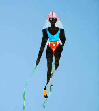 A kite featuring an African athlete flies in the sky in Hankou, Central China's Hubei province, March 23, 2008. A kite flying contest with the theme of Beijing Olympics was held there. [Asianewsphoto]