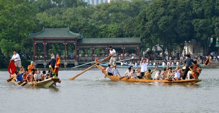 Two dragon boats compete on the west lake in Fuzhou, capital of southeast China's Fujian Province, on June 4, 2008. 