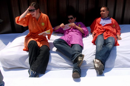 Having fun jumping on giant 'bed'