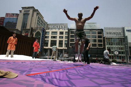 Having fun jumping on giant 'bed'