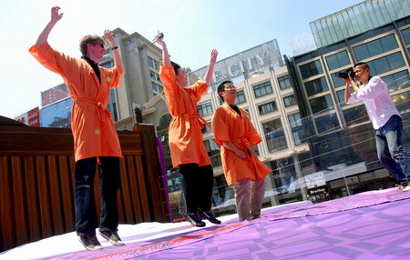 Having fun jumping on giant 'bed'