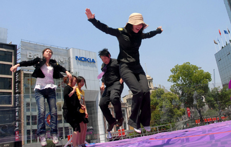 Having fun jumping on giant 'bed'