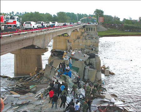 4 killed as overloaded truck sinks bridge