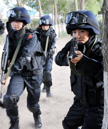 Special policewomen kick, fight and shoot during training