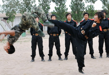 Special policewomen kick, fight and shoot during training