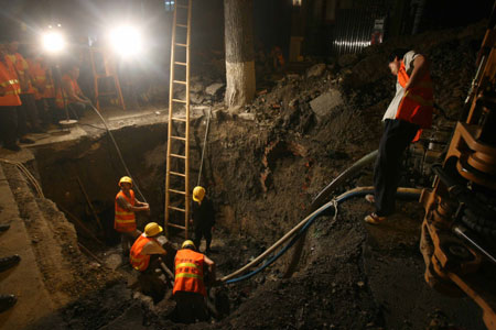 Sink holes in Beijing streets after rainstorm