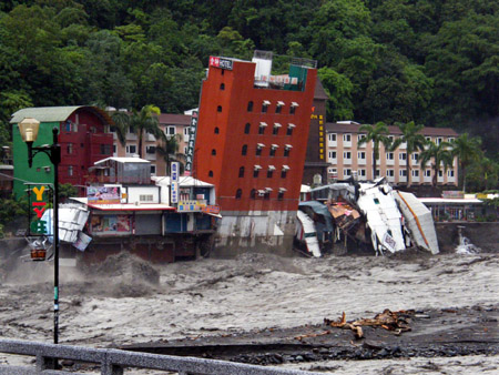 Hotel swept into river after typhoon