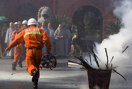 Monks at fireproofing class in central China