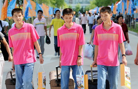 From womb to dorm, triplets all in a row