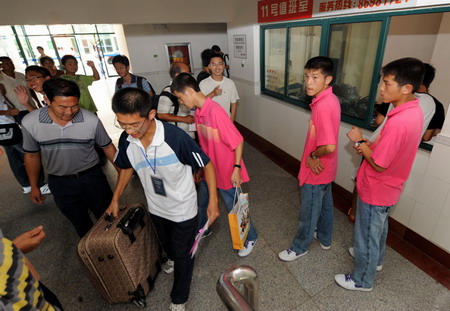 From womb to dorm, triplets all in a row
