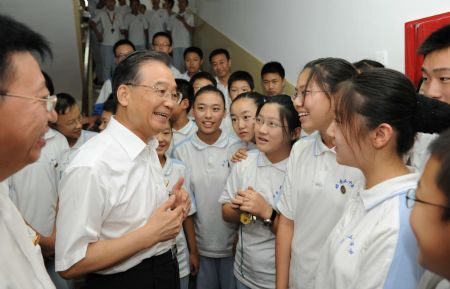 Paying tribute to teachers, premier sits in on classes