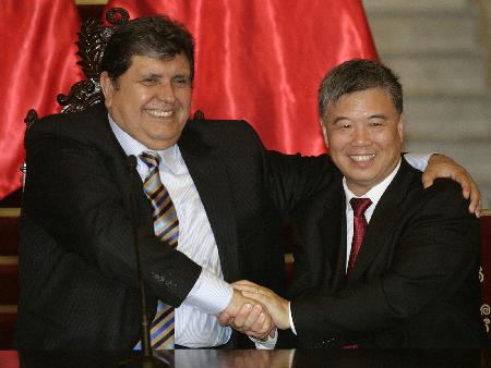 Peru's President Garcia and China's Ambassador in Peru Wuyi shake hands in Lima